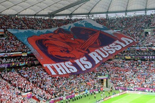 Russia's football fans display a giant banner